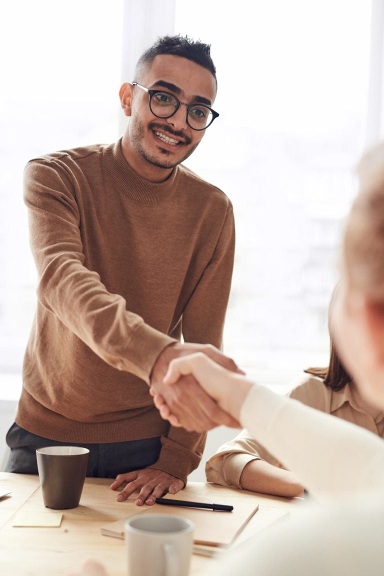 effective-communication-training Man shaking employee hand in good communication